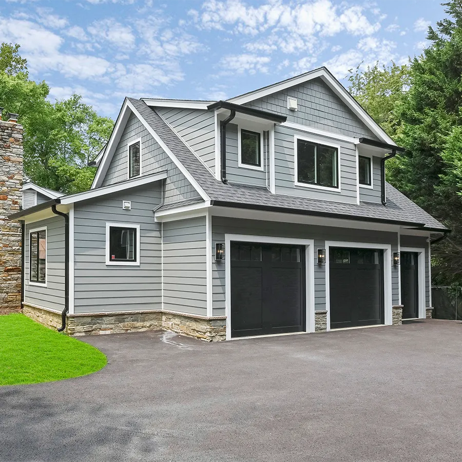 home exterior with black garage doors